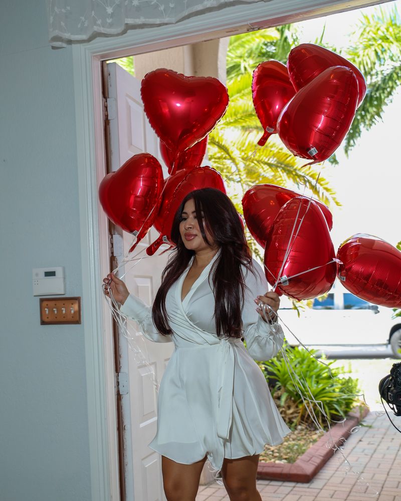 Cindy with balloons at a client's new home